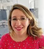 A person wearing glasses and a red shirt
Description automatically generated