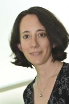 A person with short dark hair
Description automatically generated